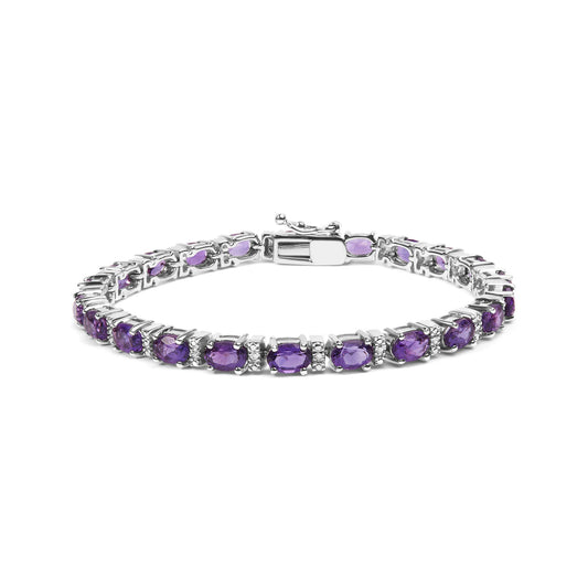 White metal bracelet with oval purple gemstones and round white gemstones in shared prong setting, displayed in a front angled view.