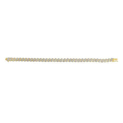Yellow bracelet with diagonal links featuring white round gemstones in pave setting, shown flat from the top angle.
