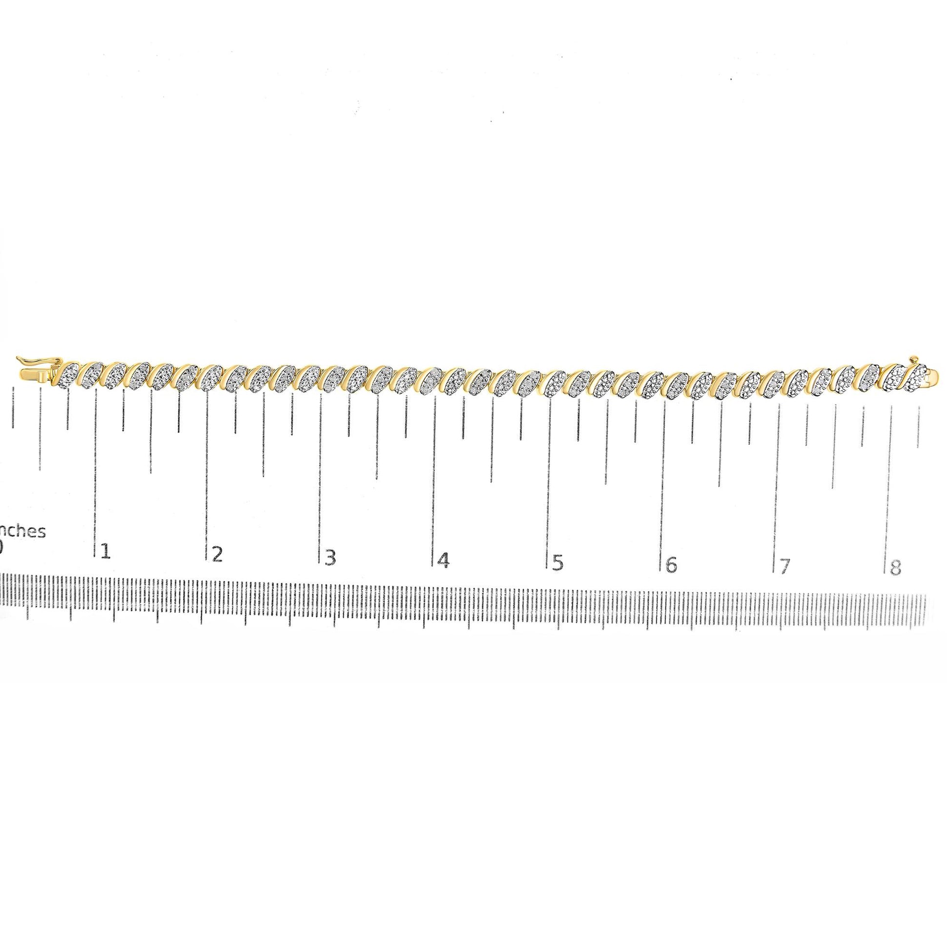 Yellow metal bracelet with alternating links featuring white round gemstones in a pave setting, shown flat on a ruler for size reference, top-down angle.