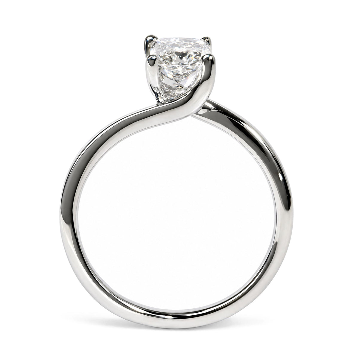 Close-up front angle of a white metal ring with a single radiant-shaped white gemstone in a prong setting.