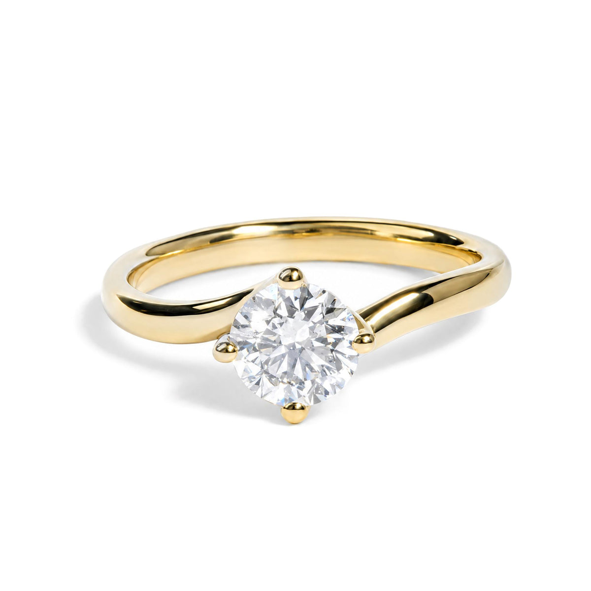 Yellow ring with a round white gemstone in a prong setting, shown in a close-up top front angle on a white background.