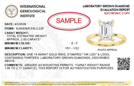 Alt text: Yellow metal ring with a large emerald-shaped white gemstone in a prong setting, surrounded by smaller round white gemstones in prong settings, shown at a slight angle.