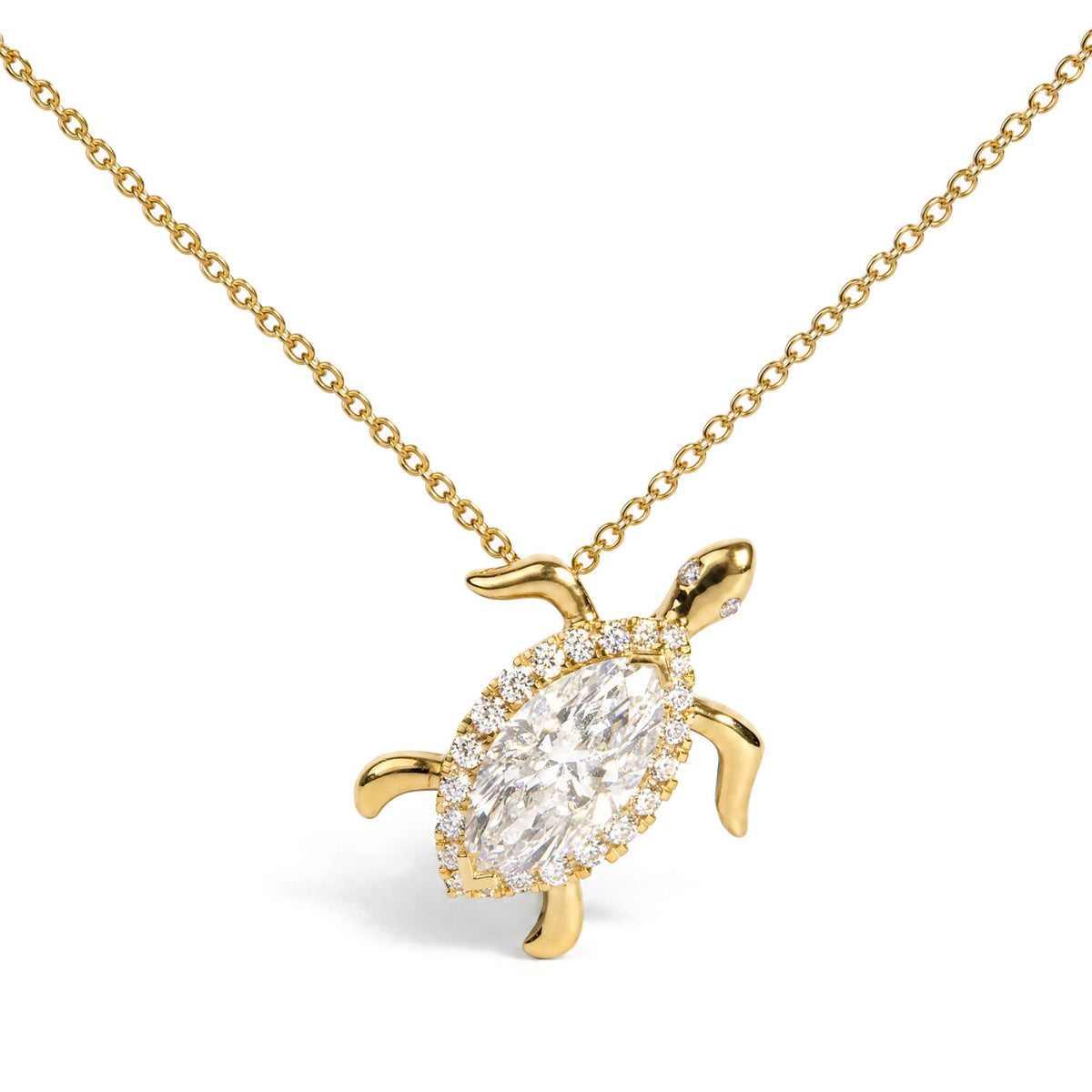 Close-up front angle of a yellow metal necklace with a turtle-shaped pendant featuring a large marquise-shaped white gemstone in the center, surrounded by round white gemstones.