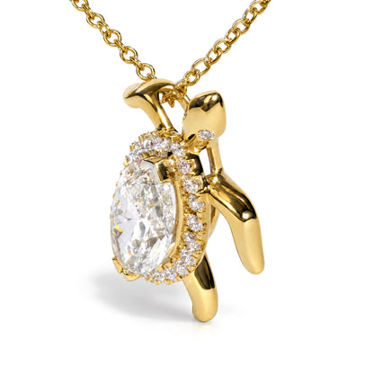 Close-up front angle of a yellow metal necklace pendant with a large oval white gemstone center, surrounded by smaller round white gemstones, and accented with a marquise white gemstone, shown on a white background.