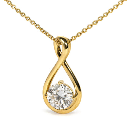 Close-up front view of a yellow necklace with a twisted teardrop-shaped pendant featuring a round white gemstone in a four-prong setting.