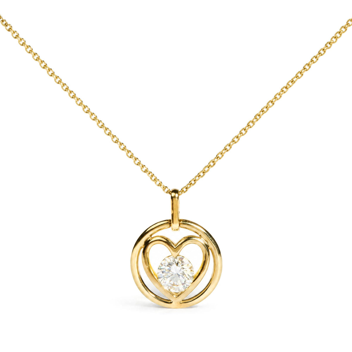 Close-up front view of a yellow necklace with a heart-shaped pendant featuring a round white gemstone in bezel setting at the center.