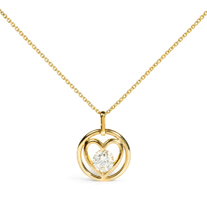 Close-up front view of a yellow necklace with a heart-shaped pendant featuring a round white gemstone in bezel setting at the center.