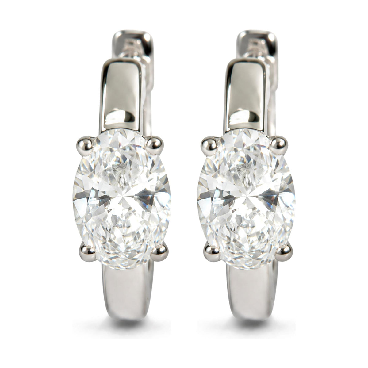 Close-up front view of white metal earrings featuring oval-shaped white gemstones in four-prong settings.