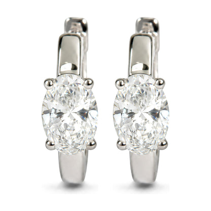 Close-up front view of white metal earrings featuring oval-shaped white gemstones in four-prong settings.