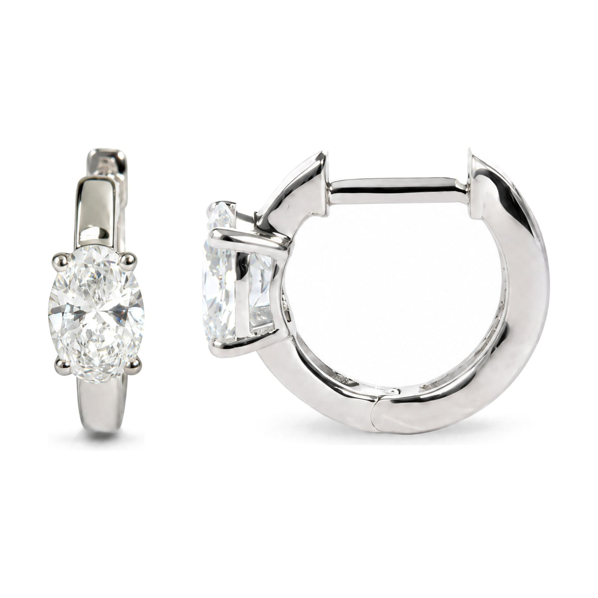 Close-up front and side angle of white metal hoop earrings featuring oval-shaped white gemstones in 4-prong settings.
