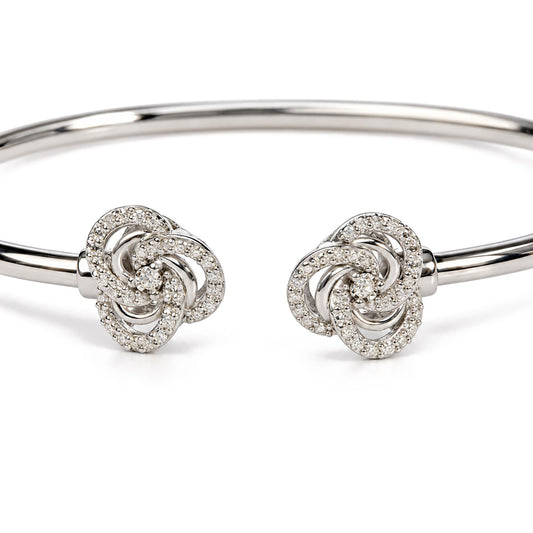 Front view of 925 sterling silver diamond accent love knot flexy open bangle bracelet on white background