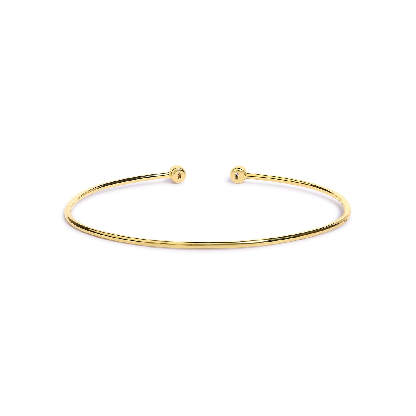 Open-ended thin bracelet in yellow and white metal with round white gemstones in bezel settings at each end, shown from a front angle on a white background.