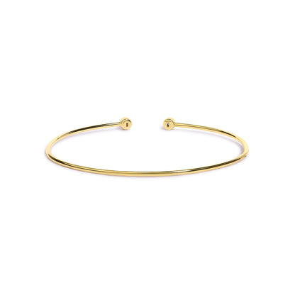 Open-ended thin bracelet in yellow and white metal with round white gemstones in bezel settings at each end, shown from a front angle on a white background.