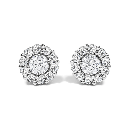 Pair of white metal round stud earrings with a central round white gemstone in four-prong setting, surrounded by smaller round white gemstones in shared prong setting, shown from the front on a white background.