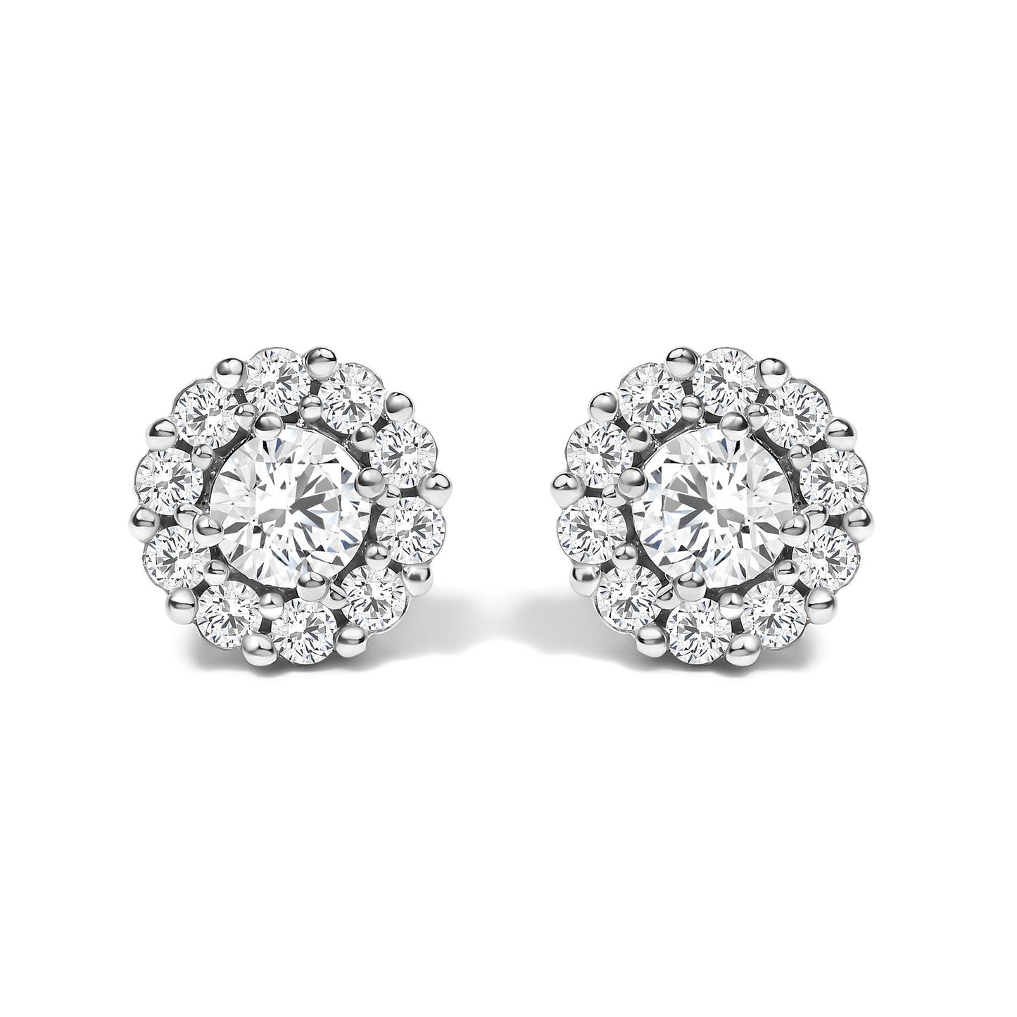 Pair of round white metal stud earrings with a central round white gemstone in four-prong setting, surrounded by smaller round white gemstones in shared prong setting, shown from the front angle on a white background.