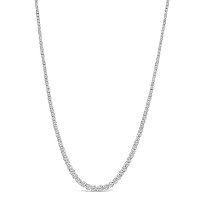Front-facing shot of a white necklace with numerous white round gemstones in four-prong settings along the entire chain.