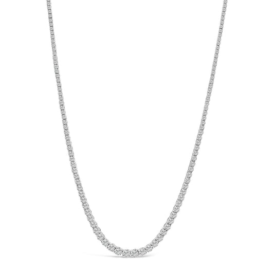Front-facing shot of a white necklace with numerous white round gemstones in four-prong settings along the entire chain.