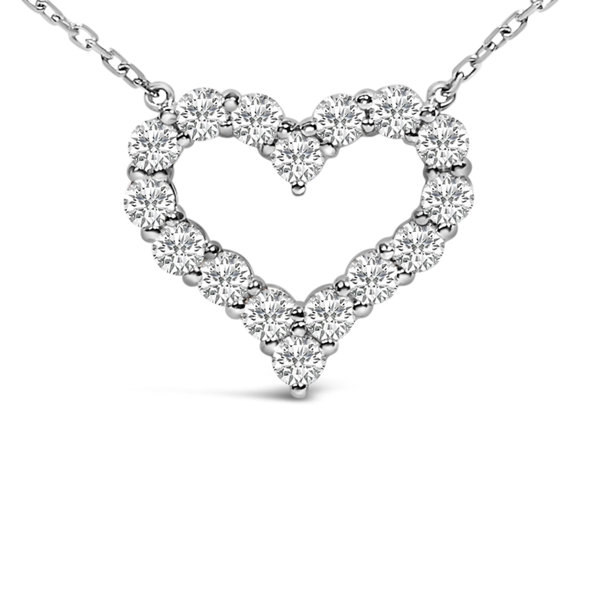 Close-up front view of a white necklace featuring a heart-shaped pendant made of round white gemstones in a shared prong setting.