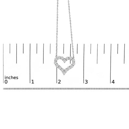 White metal necklace with heart-shaped pendant made of round white gemstones in shared prong setting, shown hanging centered on a ruler for scale, front view.