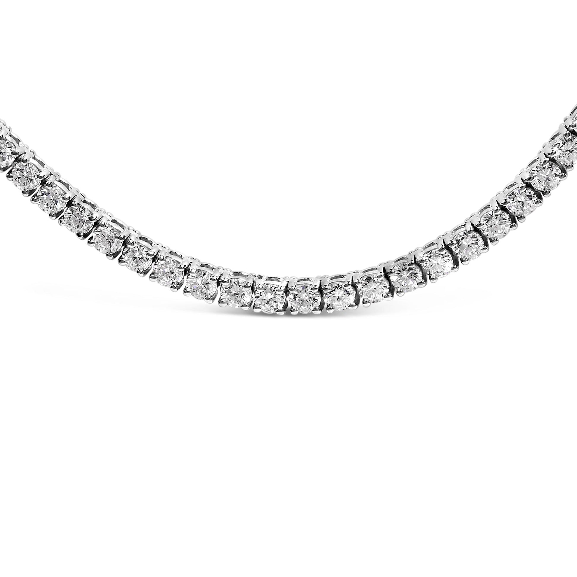 Close-up front angle of a white metal necklace featuring round white gemstones in a 4-prong setting.