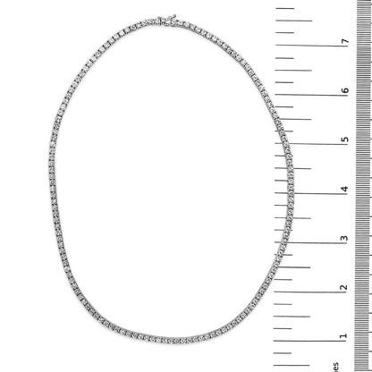 White metal necklace with round white gemstones in 4-prong settings, shown flat on a white background with a measurement scale on the right, top-down angle.