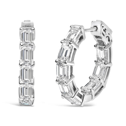 Close-up front and side angled view of a pair of white hoop earrings set with multiple emerald-shaped white gemstones in a shared prong setting.