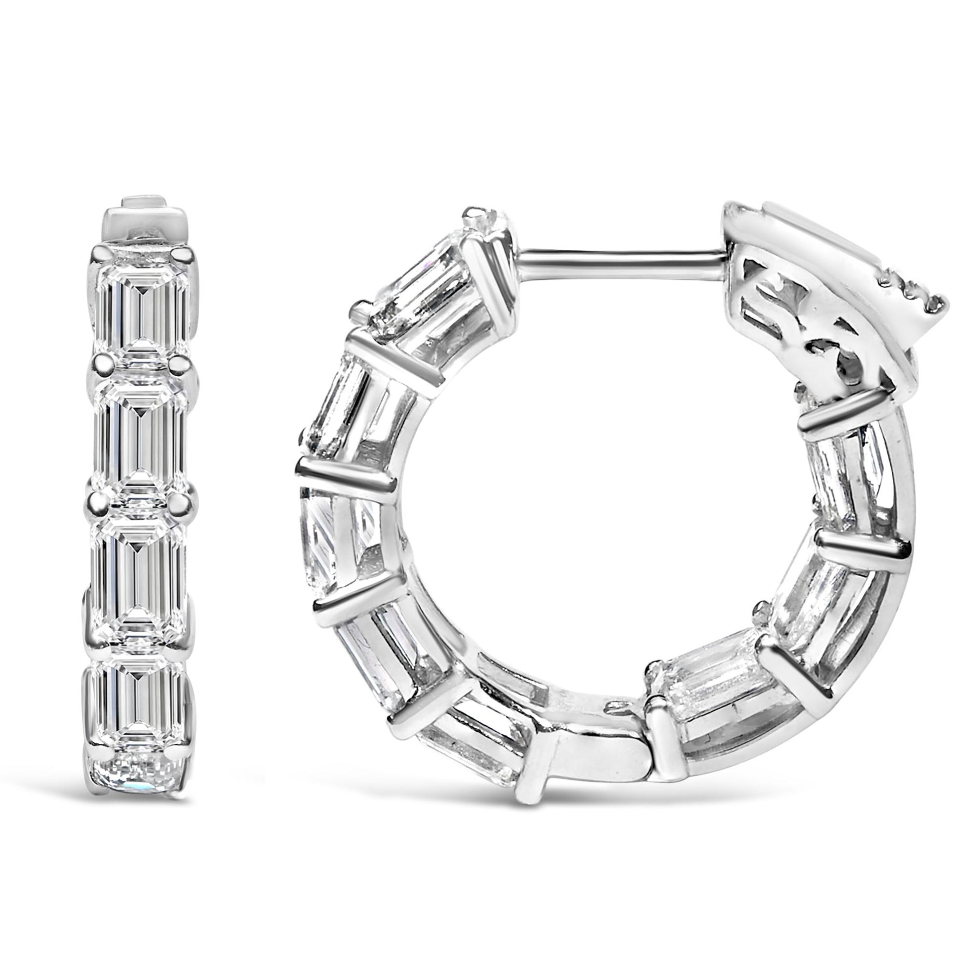 Close-up front and side views of white metal hoop earrings set with multiple emerald-shaped white gemstones in shared prong settings.