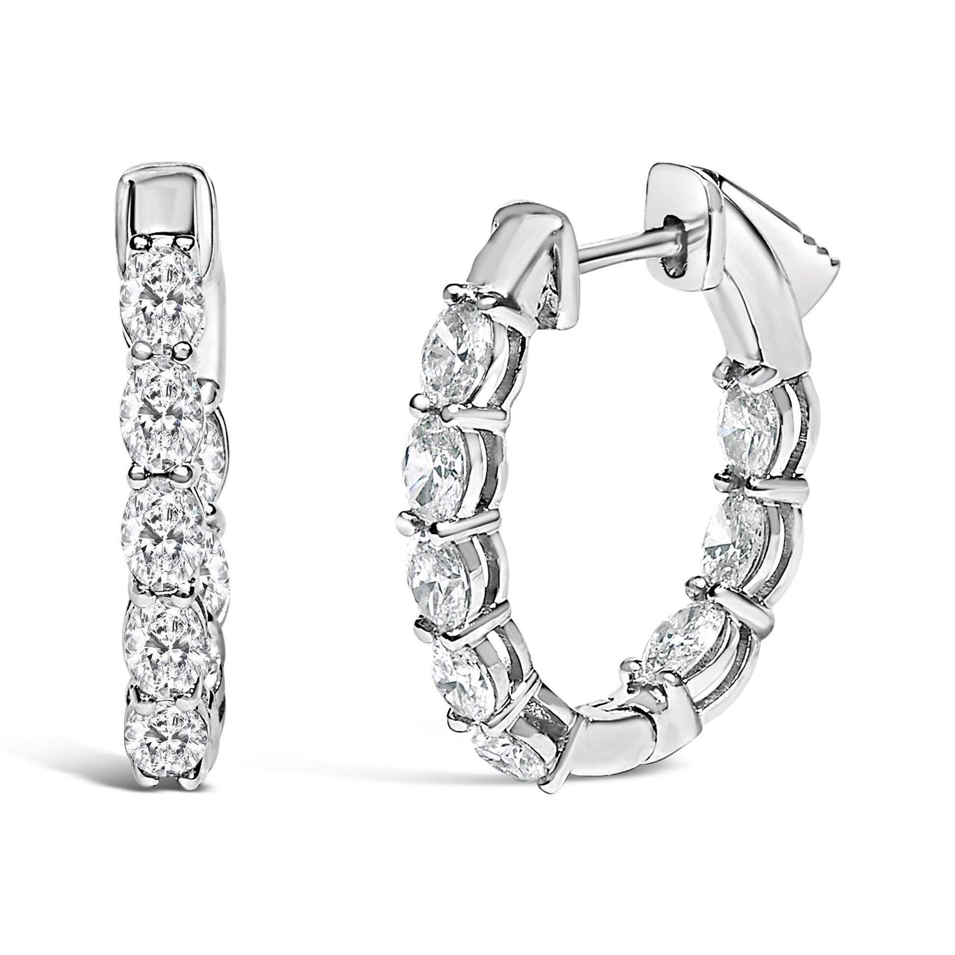 Close-up front and side view of white hoop earrings set with oval-shaped white gemstones in shared prong settings.