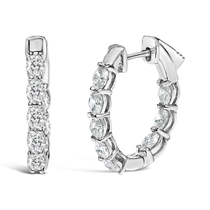 Close-up front and side view of white hoop earrings set with oval-shaped white gemstones in shared prong settings.