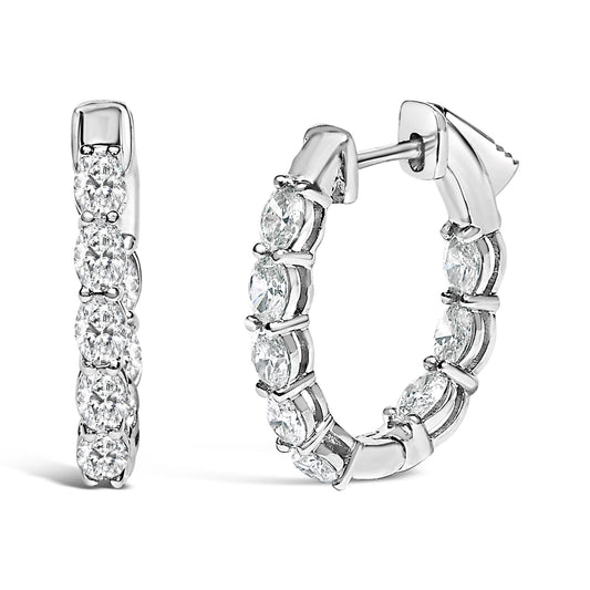 Close-up front and side view of white hoop earrings set with oval-shaped white gemstones in shared prong settings.