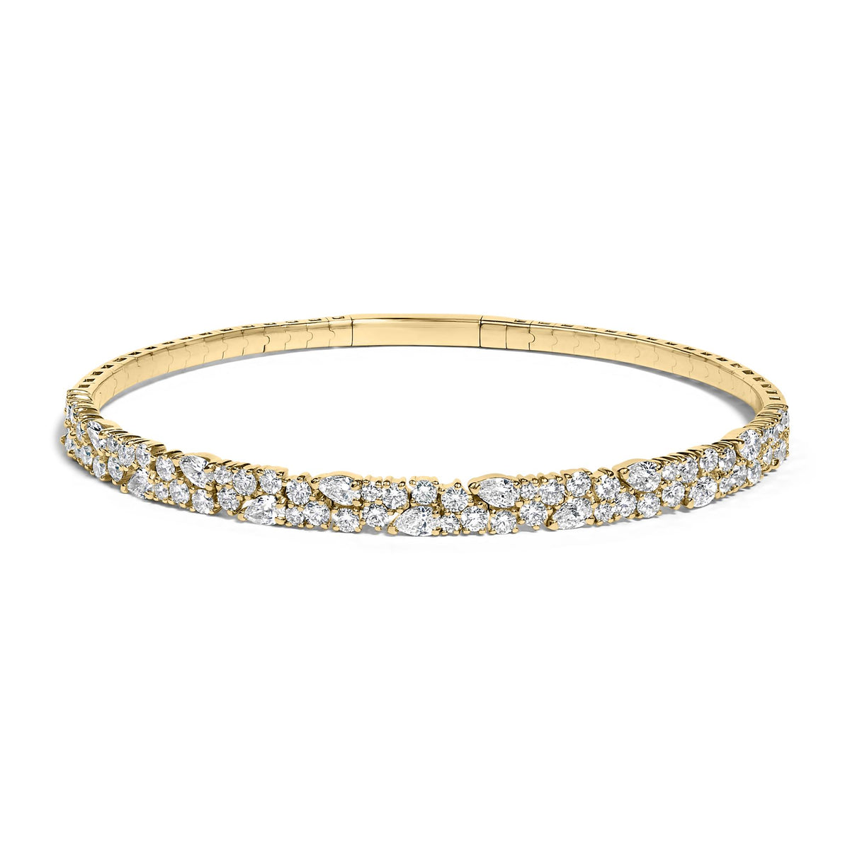 Close-up front view of a yellow metal bracelet adorned with round and pear-shaped white gemstones in prong settings, shown on a white background.