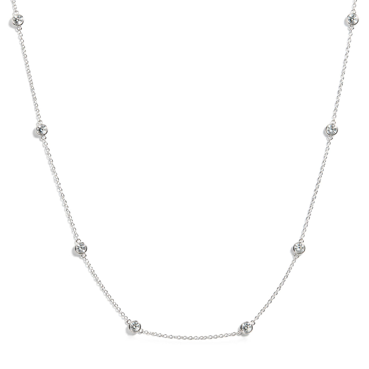 White necklace with round white gemstones in bezel settings along chain, shown on white background with front view.