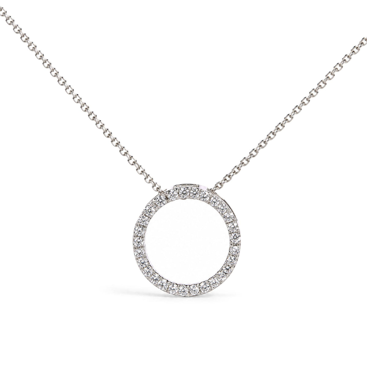Close-up front angle of a white circular pendant necklace featuring round white gemstones in prong settings along the circle, suspended from a white metal chain.