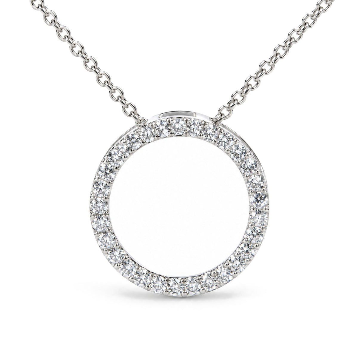 Close-up front view of a white metal necklace featuring a circular pendant encrusted with round white gemstones in a prong setting, shown on a white background.