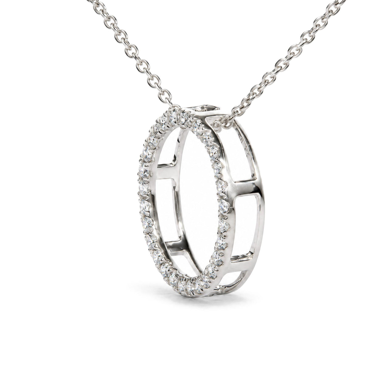 Close-up front angle of a white metal necklace pendant featuring two interlocking open oval shapes, one oval outlined with round white gemstones in prong settings.