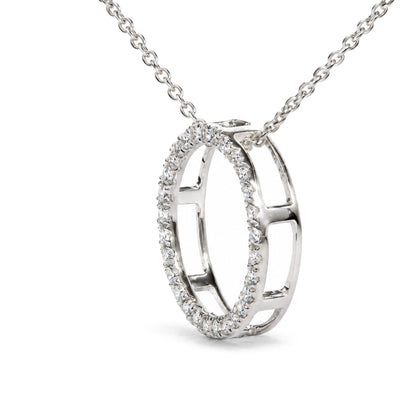 Close-up front angle of a white metal necklace pendant featuring two interlocking open oval shapes, one oval outlined with round white gemstones in prong settings.