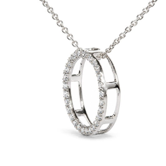 Close-up front angle of a white metal necklace pendant featuring two interlocking open oval shapes, one oval outlined with round white gemstones in prong settings.