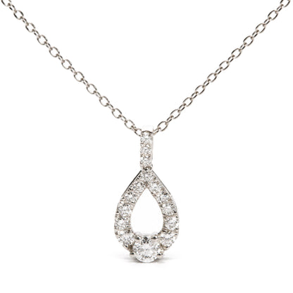 Close-up front view of a white necklace chain with a teardrop-shaped pendant encrusted with round white gemstones in prong settings, shown on a white background.