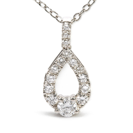 Front angled view of sterling silver lab-grown diamond open pear pendant necklace with round stones on white background