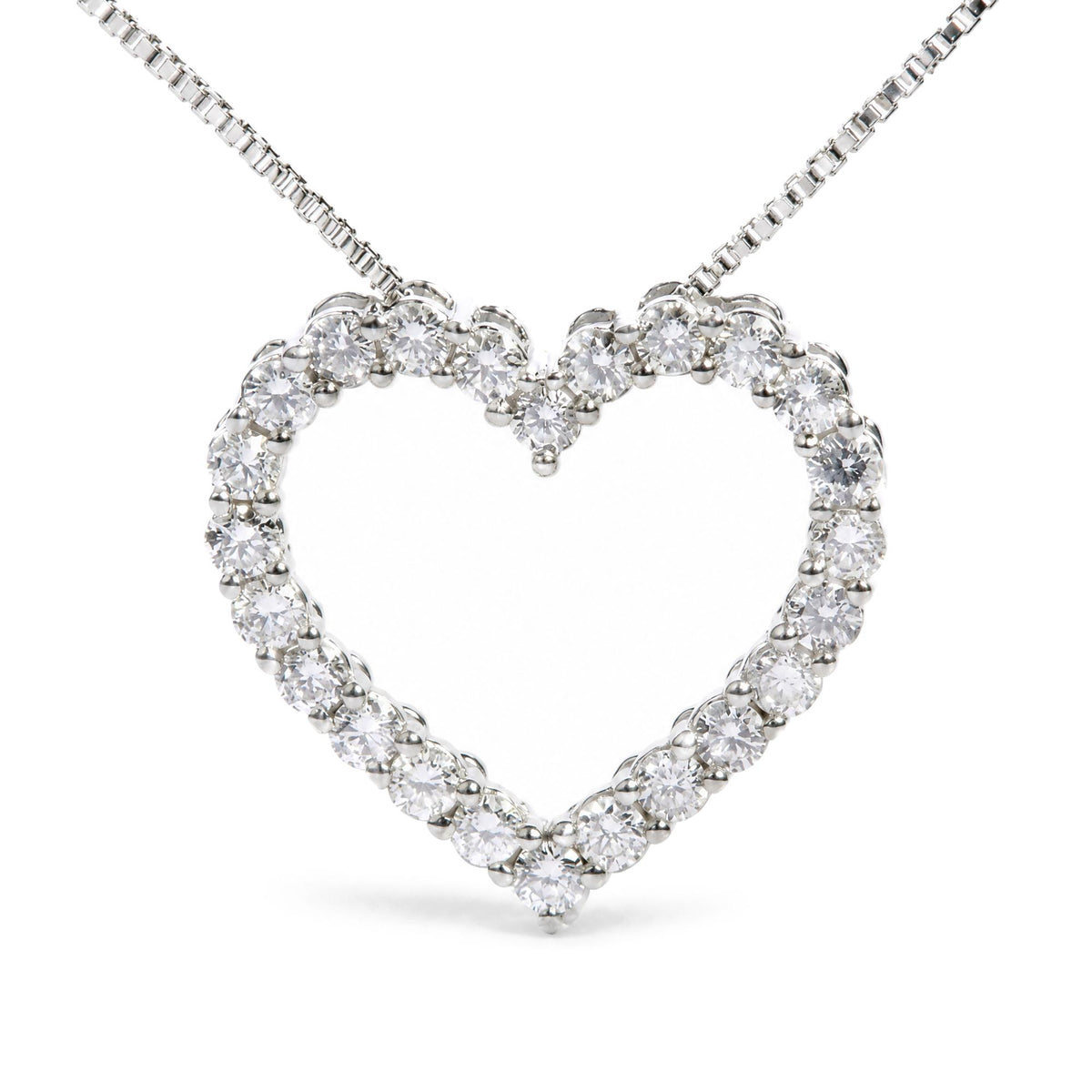 Close-up front view of a white metal heart-shaped necklace pendant adorned with round white gemstones in prong settings.