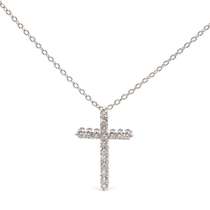 Front view of a white necklace chain with a cross pendant adorned with round white gemstones in prong settings.