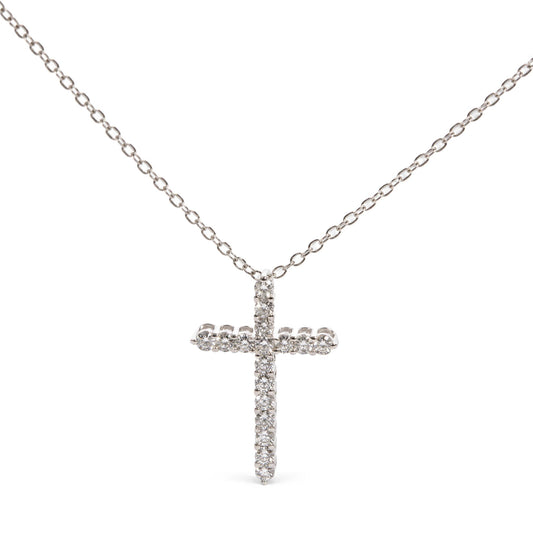 Front view of a white necklace chain with a cross pendant adorned with round white gemstones in prong settings.