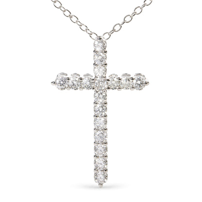 Close-up front view of a white metal cross pendant necklace adorned with round white gemstones in prong settings, suspended from a white metal chain.