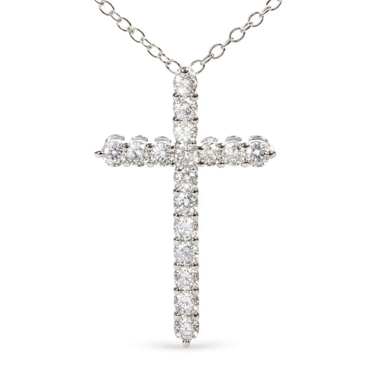 Close-up front view of a white metal cross pendant necklace adorned with round white gemstones in prong settings, suspended from a white metal chain.