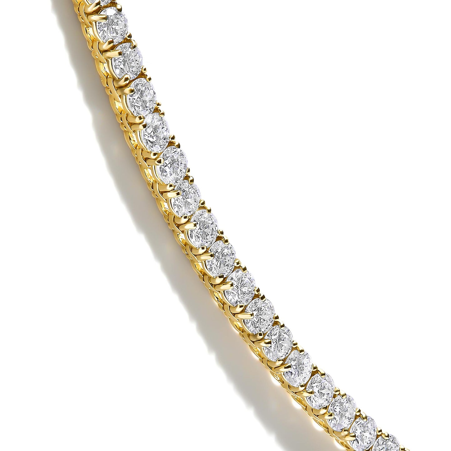 Close-up angled view of a yellow necklace featuring round white gemstones in 4-prong settings arranged in a continuous line.