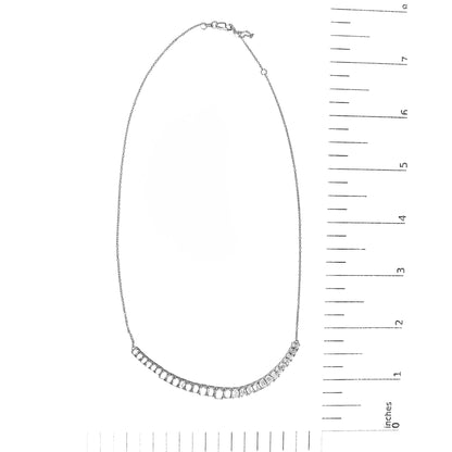 White necklace with a curved row of emerald-shaped white gemstones in 4-prong settings, shown flat on a scale, front view.