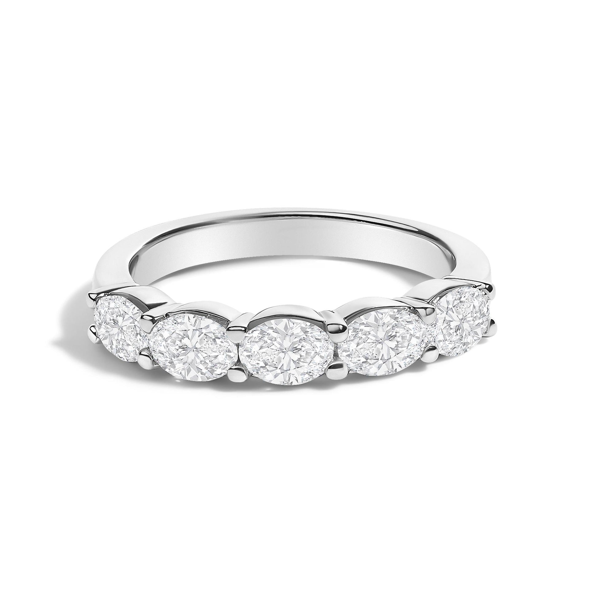 Close-up front angle of a white ring featuring five oval-shaped white gemstones set in a shared prong setting.