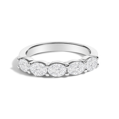 Close-up front angle of a white ring featuring five oval-shaped white gemstones set in a shared prong setting.