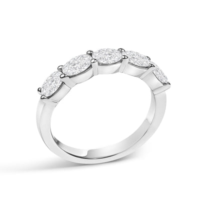 White metal ring with five oval-shaped white gemstones set in a shared prong setting, shown at a slight angle against a white background.
