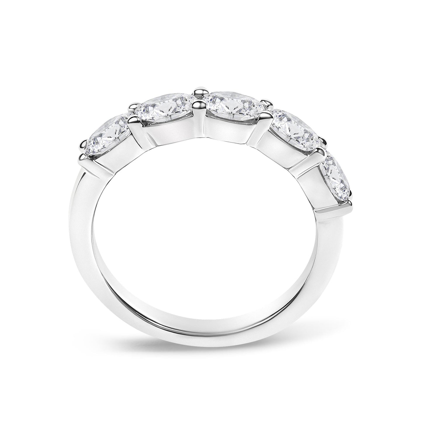 White metal ring with five oval-shaped white gemstones in a shared prong setting, shown in a close-up side angle.